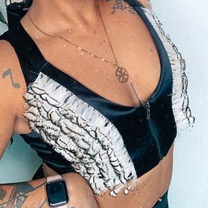 Black BEBE vest with feathers